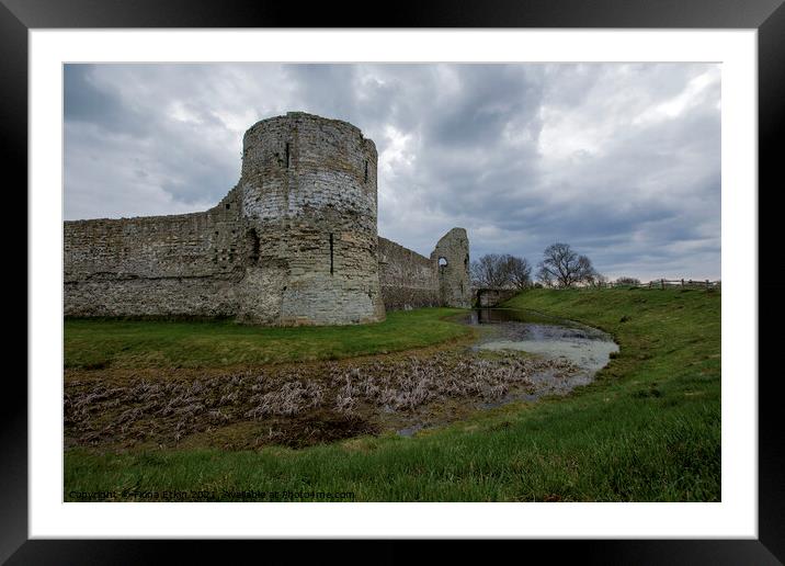 Pevensey Castle under a moody sky Framed Mounted Print by Fiona Etkin