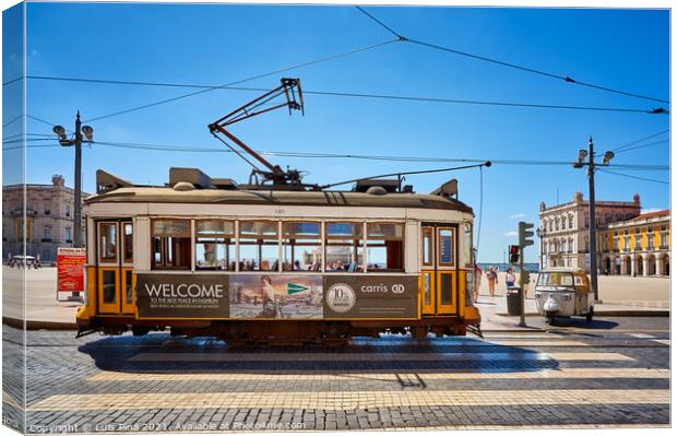 Lisbon Yellow Tram on a street in Terreiro do Paco, Portugal Canvas Print by Luis Pina