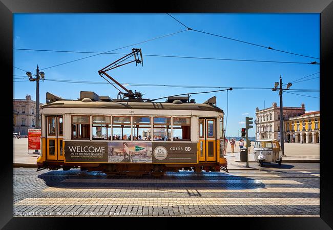 Lisbon Yellow Tram on a street in Terreiro do Paco, Portugal Framed Print by Luis Pina