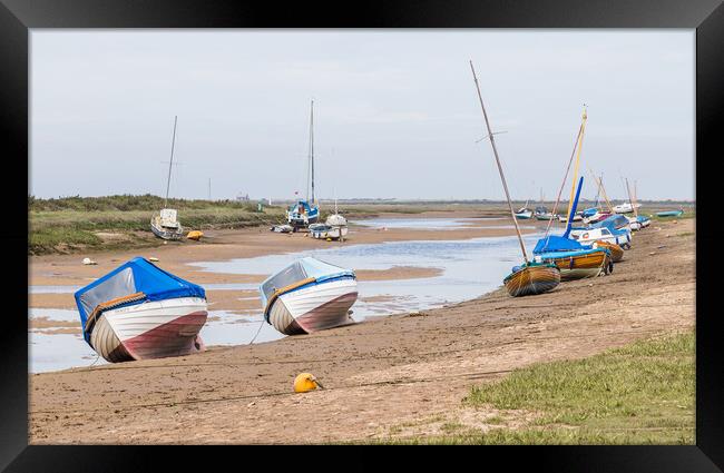 Boats beached at Blakeney Framed Print by Jason Wells