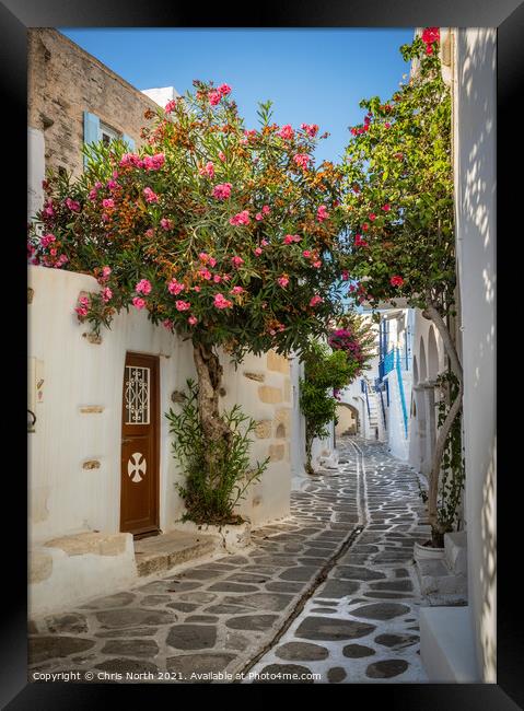 The back streets of old  Paros town. Framed Print by Chris North