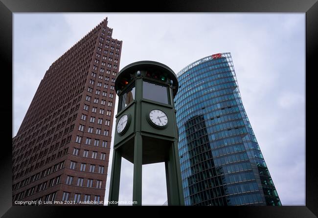 Historic clock on Potsdamer Platz in Berlin Framed Print by Luis Pina