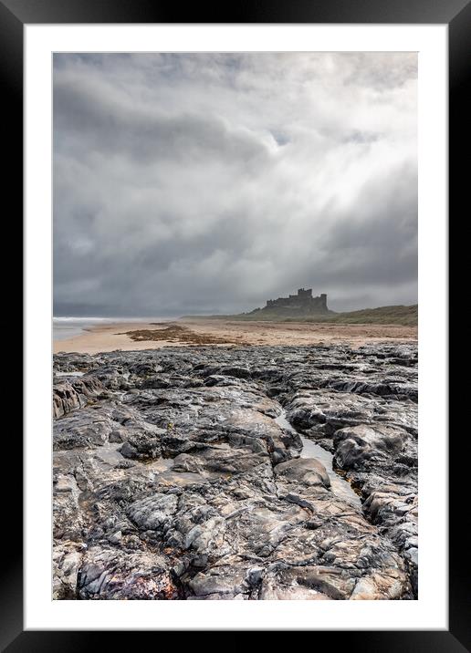 Majestic Bamburgh Castle Amidst a Stormy Sky Framed Mounted Print by James Marsden