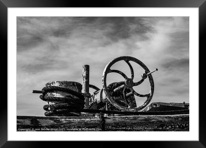 An old barge anchor winch in monochrome Framed Mounted Print by Ann Biddlecombe