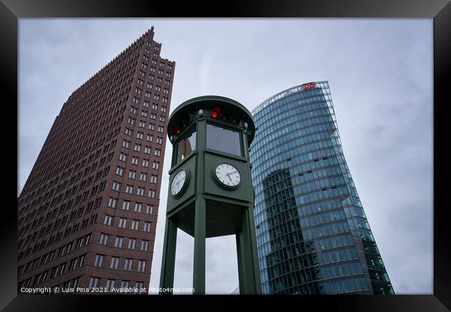Historic clock on Potsdamer Platz in Berlin Framed Print by Luis Pina