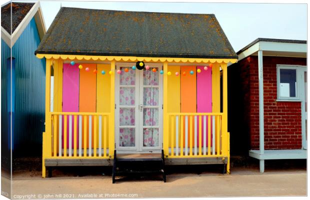 Colorful beach hut. Canvas Print by john hill
