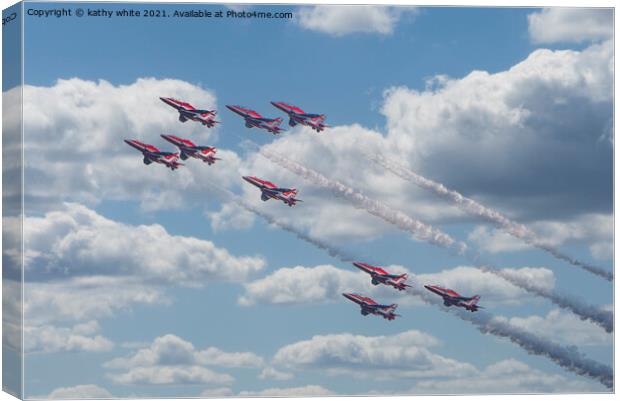 Red arrows in a cornish sky,smoke trails,   Canvas Print by kathy white