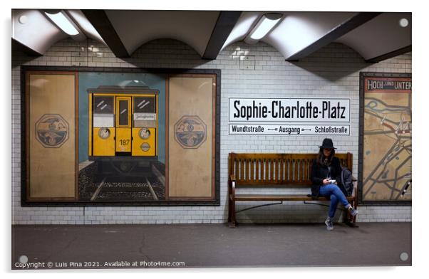 Woman sitting on a bench at Sophie Charlotte Platz subway station in Berlin Acrylic by Luis Pina