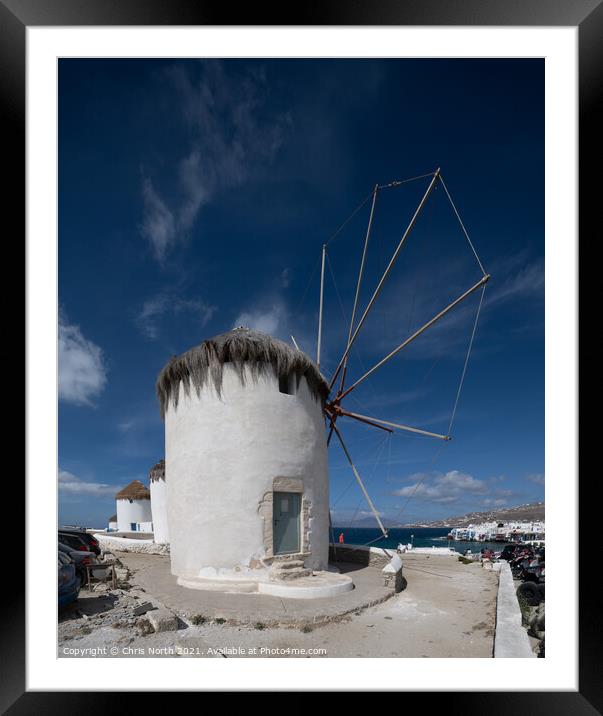 Windmills overlooking Mykonos town. Framed Mounted Print by Chris North