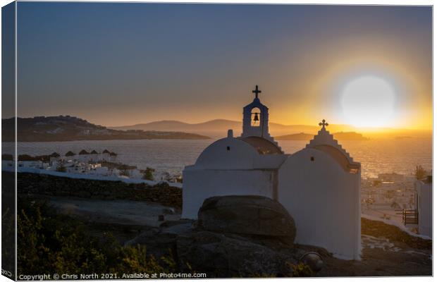 Sunset over the Aegean Sea in Mykonos, Greece. Canvas Print by Chris North