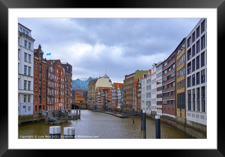 View of the Elbphilharmonie in the middle of traditional Hamburg buildings, in Germany Framed Mounted Print by Luis Pina