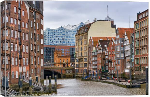 View of the Elbphilharmonie in the middle of traditional Hamburg buildings, in Germany Canvas Print by Luis Pina