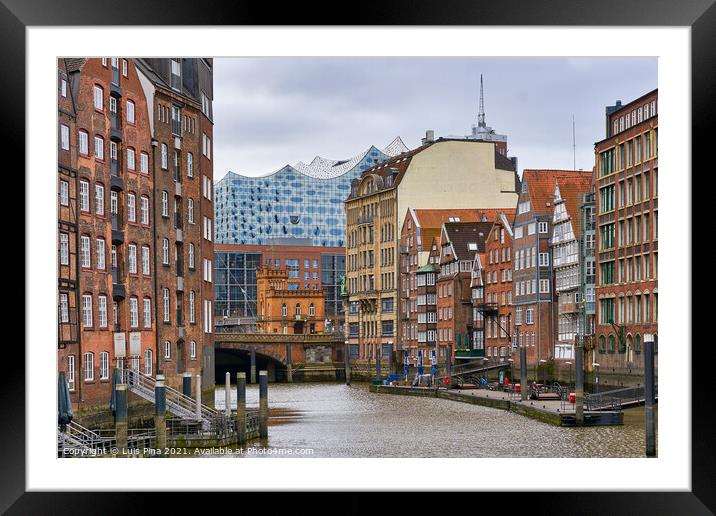 View of the Elbphilharmonie in the middle of traditional Hamburg buildings, in Germany Framed Mounted Print by Luis Pina