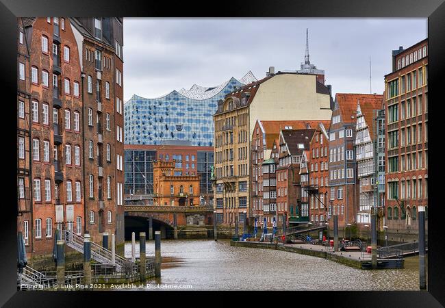 View of the Elbphilharmonie in the middle of traditional Hamburg buildings, in Germany Framed Print by Luis Pina
