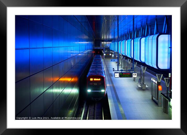 Train at the Subway station with blue lights at University on the Speicherstadt area in Hamburg Framed Mounted Print by Luis Pina