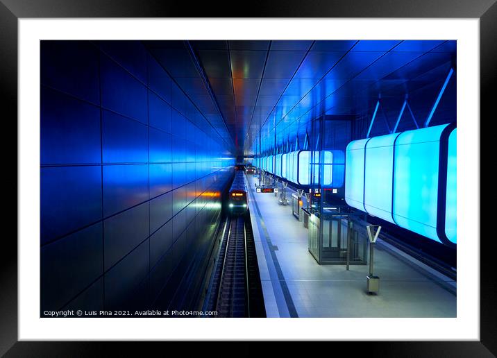 Train at the Subway station with blue lights at University on the Speicherstadt area in Hamburg Framed Mounted Print by Luis Pina