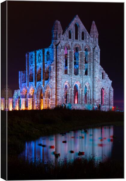 Whitby Abbey Illuminated as for Halloween and Whitby Goth Weeken Canvas Print by Martin Williams