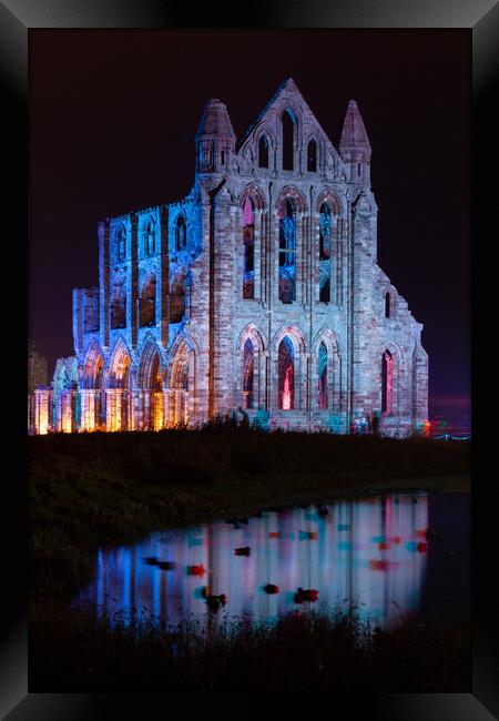 Whitby Abbey Illuminated as for Halloween and Whitby Goth Weeken Framed Print by Martin Williams