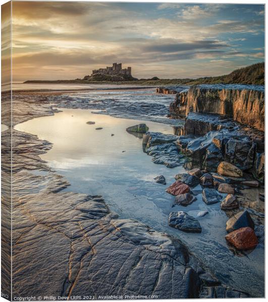 Bamburgh Castle by morning light Canvas Print by Phillip Dove LRPS