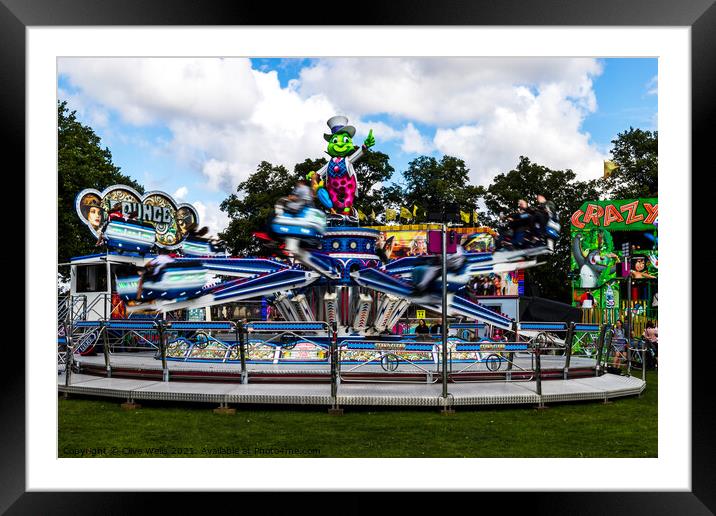 Speedy fairground ride in the WALKS, Kings Lynn. Framed Mounted Print by Clive Wells