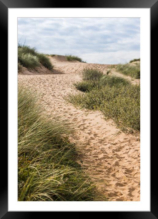 Foot prints leading to Formby beach Framed Mounted Print by Jason Wells
