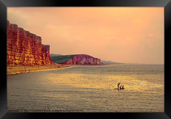 Sunset Paddle Boarders At West Bay  Framed Print by Alison Chambers