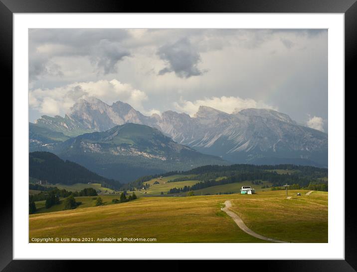 Sassolungo mountains on the Italian Alps Dolomites and a rainbow Framed Mounted Print by Luis Pina