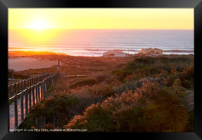 Praia do Guincho Beach and Hotel Fortaleza on a summer day in Sintra, Portugal Framed Print by Luis Pina