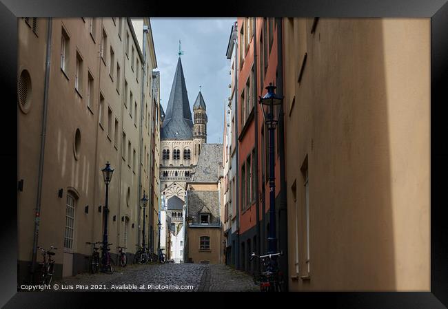 Great St Martin Church seen from an antique and medieval buildings street Framed Print by Luis Pina