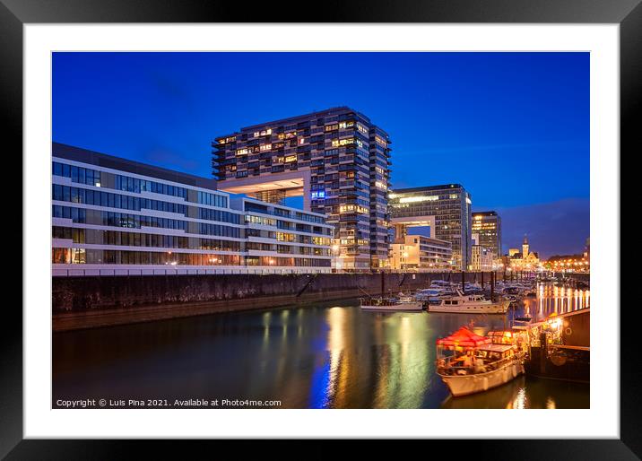 Rheinauhafen water promenade in Cologne Koeln marina at night with boats on the water Framed Mounted Print by Luis Pina