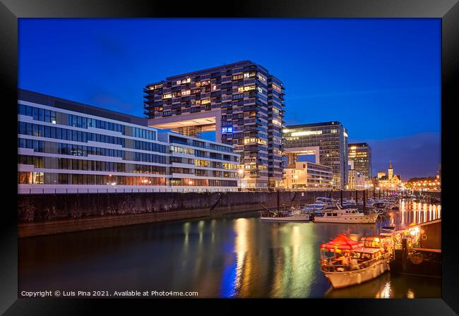 Rheinauhafen water promenade in Cologne Koeln marina at night with boats on the water Framed Print by Luis Pina