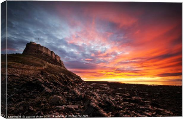 Fire in the Sky Lindisfarne Canvas Print by Lee Kershaw
