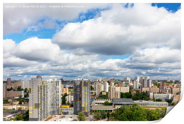 Dramatic beautiful sky with thick clouds over residential areas of the city. Print by Sergii Petruk