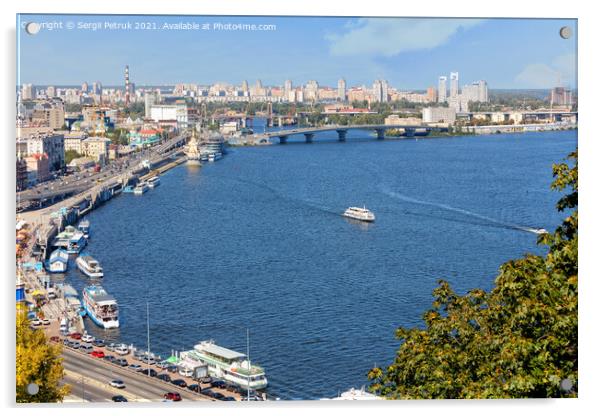 A landscape of summer Kyiv with a view of the Dnipro embankment in the old Podil district, a river station, piers, river trams and pleasure boats.30.08.20, Kyiv, Ukraine. Acrylic by Sergii Petruk