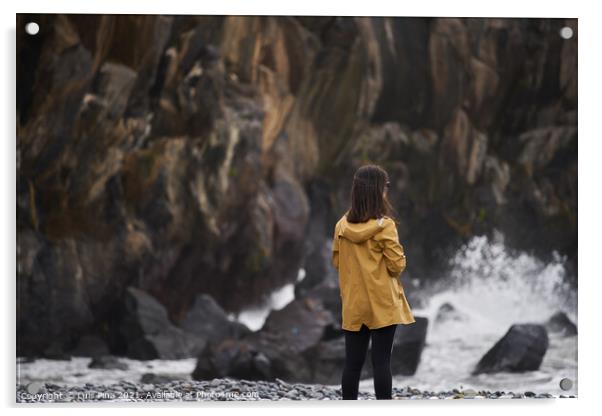 Woman on a yellow rain jacket looking to the sea with rocks on the background, in Madeira Acrylic by Luis Pina