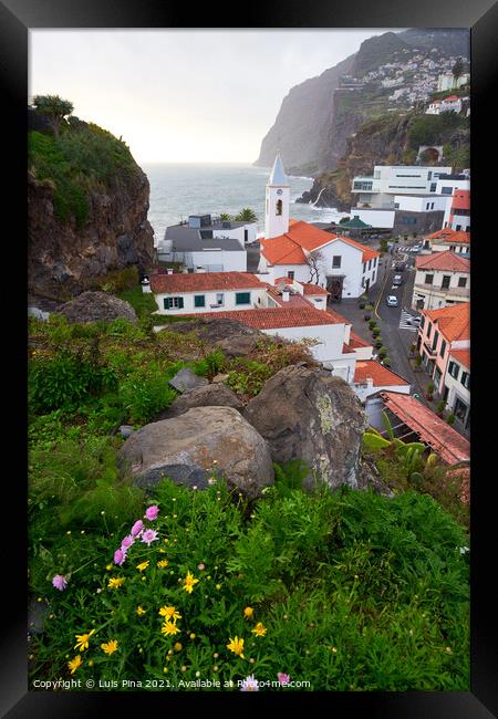 View of São Sebastião church with Cape Girão with flowers on the foreground, in Câmara de Lobos, Madeira Framed Print by Luis Pina