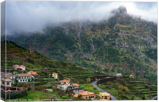 Village and beautiful mountains with clouds, in Madeira Canvas Print by Luis Pina