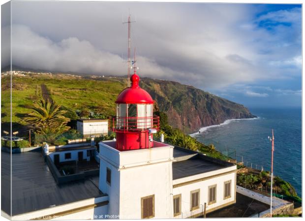 Aerial photo with drone of Ponta do Pargo Lighthouse with mountains on the background in Madeira Canvas Print by Luis Pina