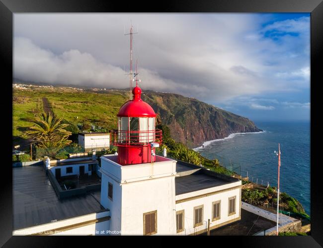Aerial photo with drone of Ponta do Pargo Lighthouse with mountains on the background in Madeira Framed Print by Luis Pina