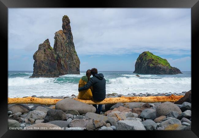 Janela Islets in Porto Moniz in Madeira with a couple sitted on a yellow tree on the ground Framed Print by Luis Pina