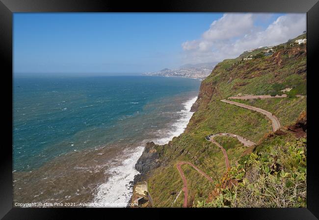 Aerial view of a road with many curves in Canico, Madeira on the coastline Framed Print by Luis Pina
