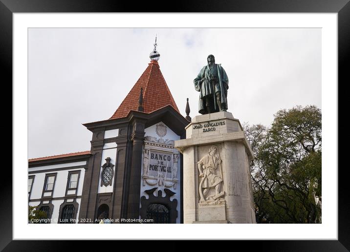 Statue of navigator João Gonçalves Zarco in Funchal, Madeira with Bank of Portugal on the background Framed Mounted Print by Luis Pina