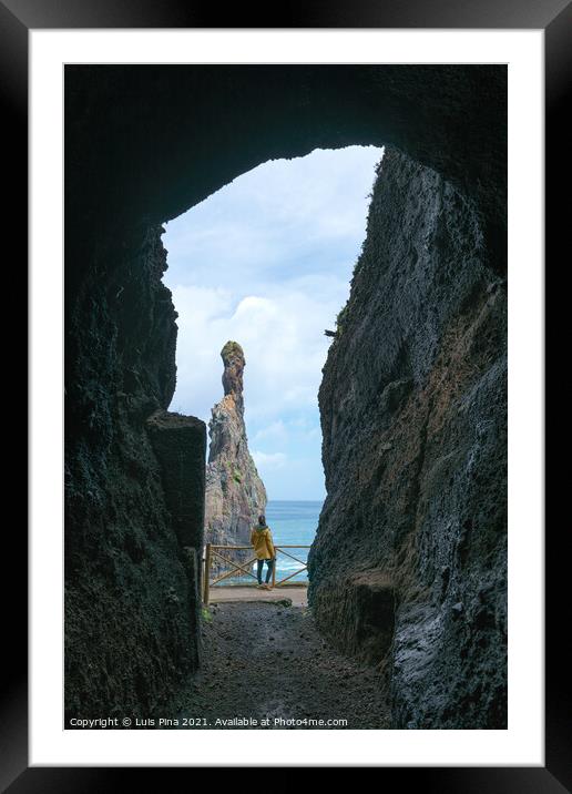 Girl looking at Ribeira da Janela islet between a cave in Madeira Framed Mounted Print by Luis Pina