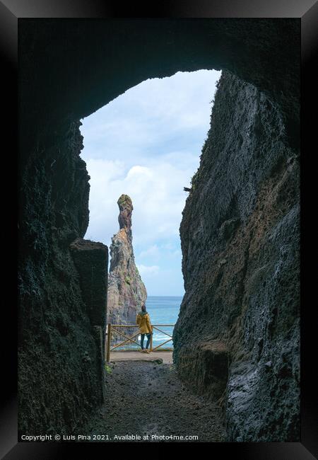 Girl looking at Ribeira da Janela islet between a cave in Madeira Framed Print by Luis Pina