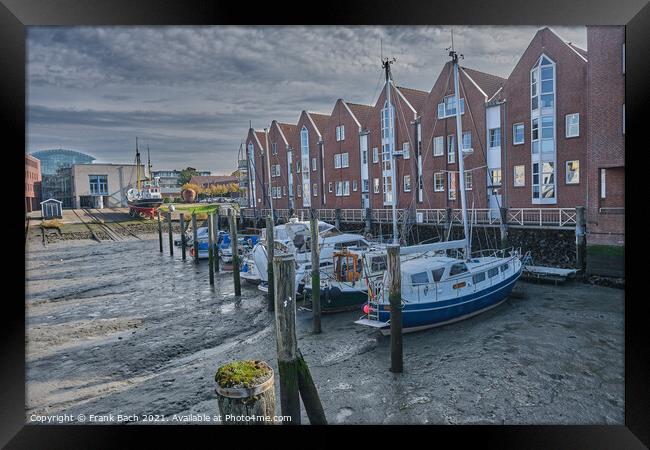 Husum harbor at ebb tide in the marshes, Germany Framed Print by Frank Bach