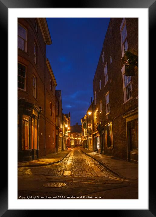 York street after night fall. Framed Mounted Print by Susan Leonard