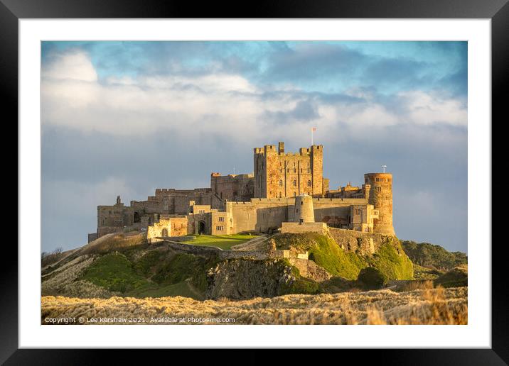 Bamburgh Castle golden light Framed Mounted Print by Lee Kershaw