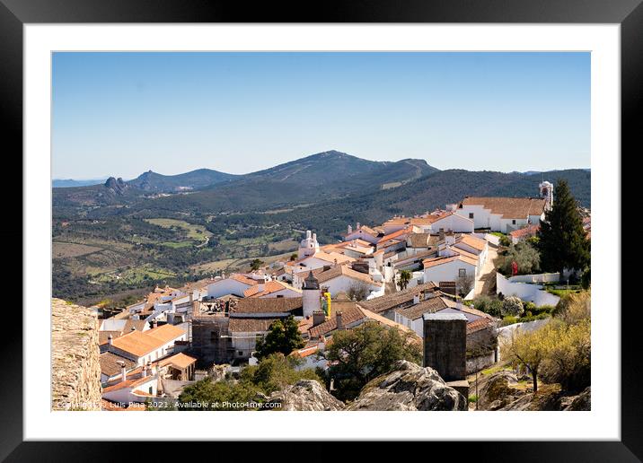 View of Marvao village with beautiful houses and church with rocky landscape mountains behind Framed Mounted Print by Luis Pina