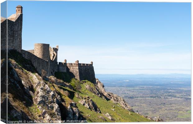 Marvao castle on the top of a mountain with beautiful green landscape behind on summer, in Portugal Canvas Print by Luis Pina