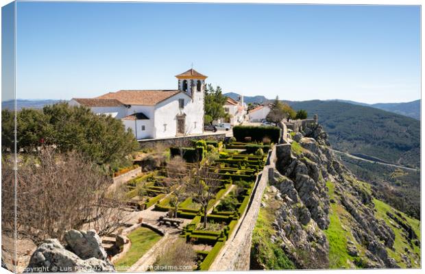 Espirito Santo church in Marvao on the middle of a beautiful landscape and city walls Canvas Print by Luis Pina